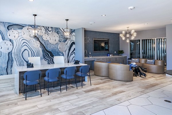 The District Clubhouse: Modern clubhouse with recreational spaces at Little Elm Apartments