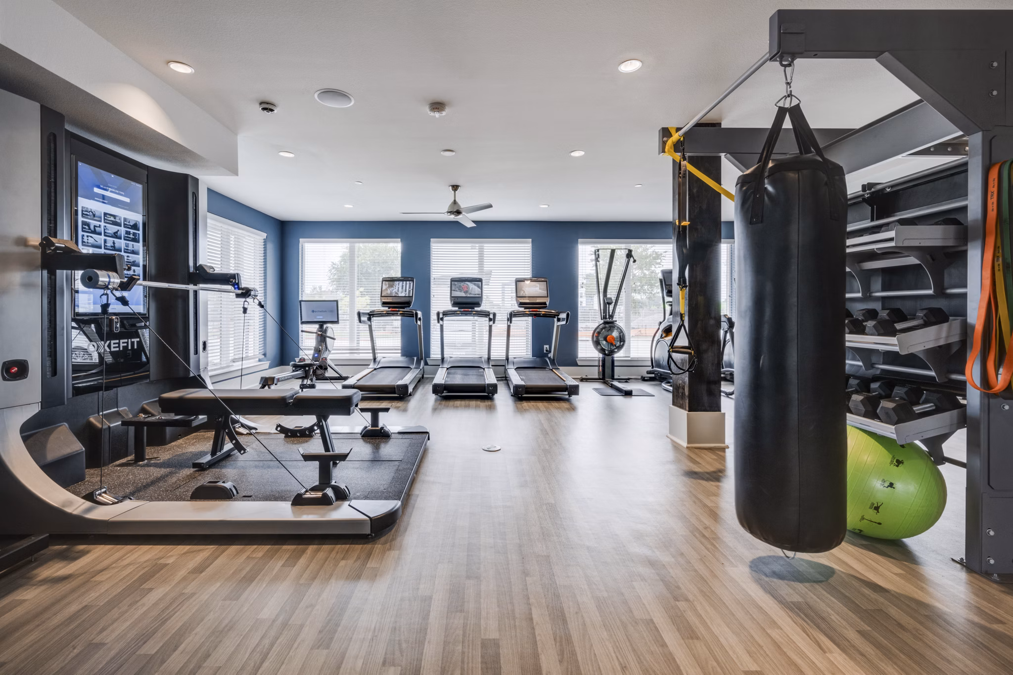 State-of-the-art fitness center with modern equipment at The District Apartments in Little Elm