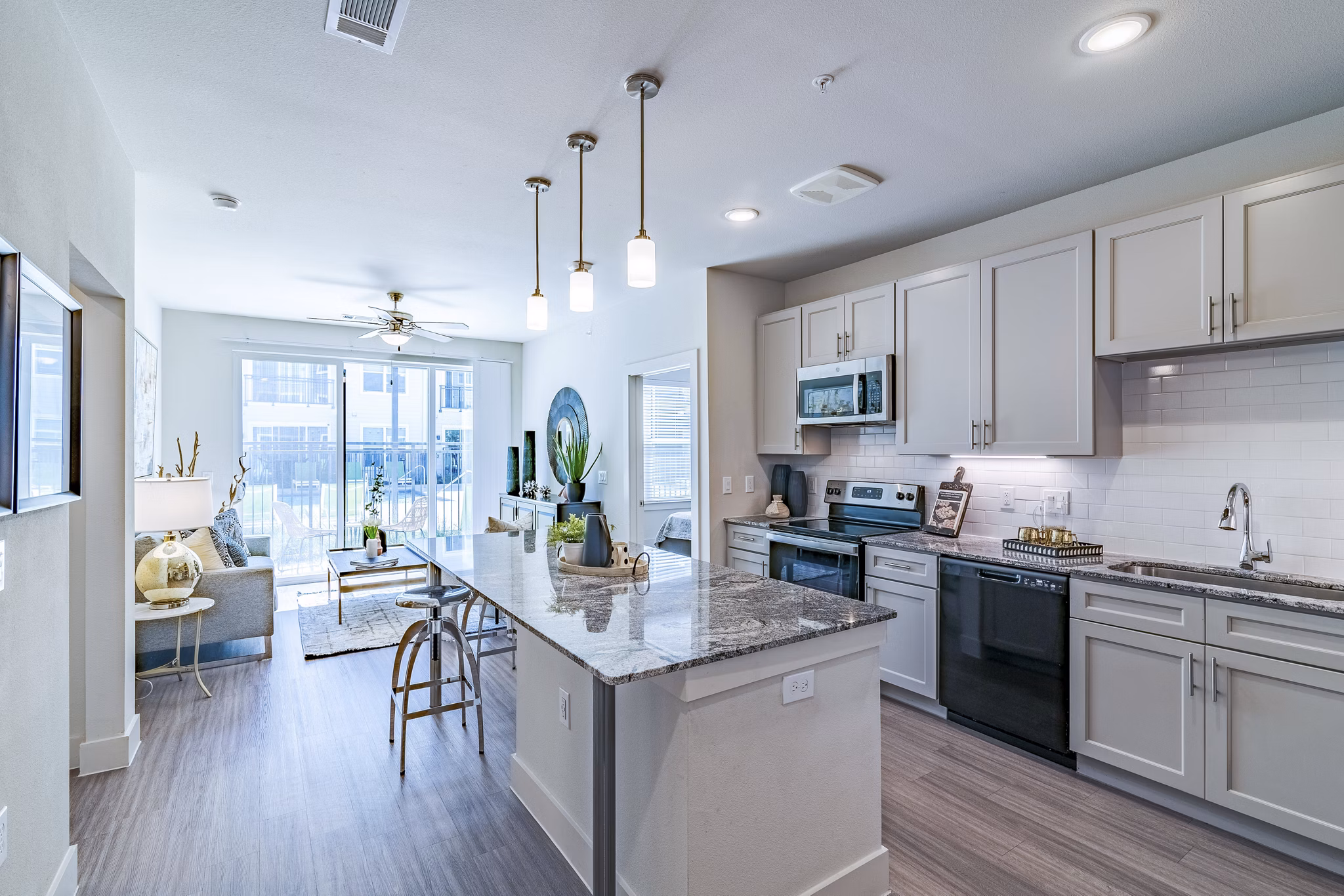 Modern kitchen with stainless steel appliances in The District luxury apartments, Little Elm