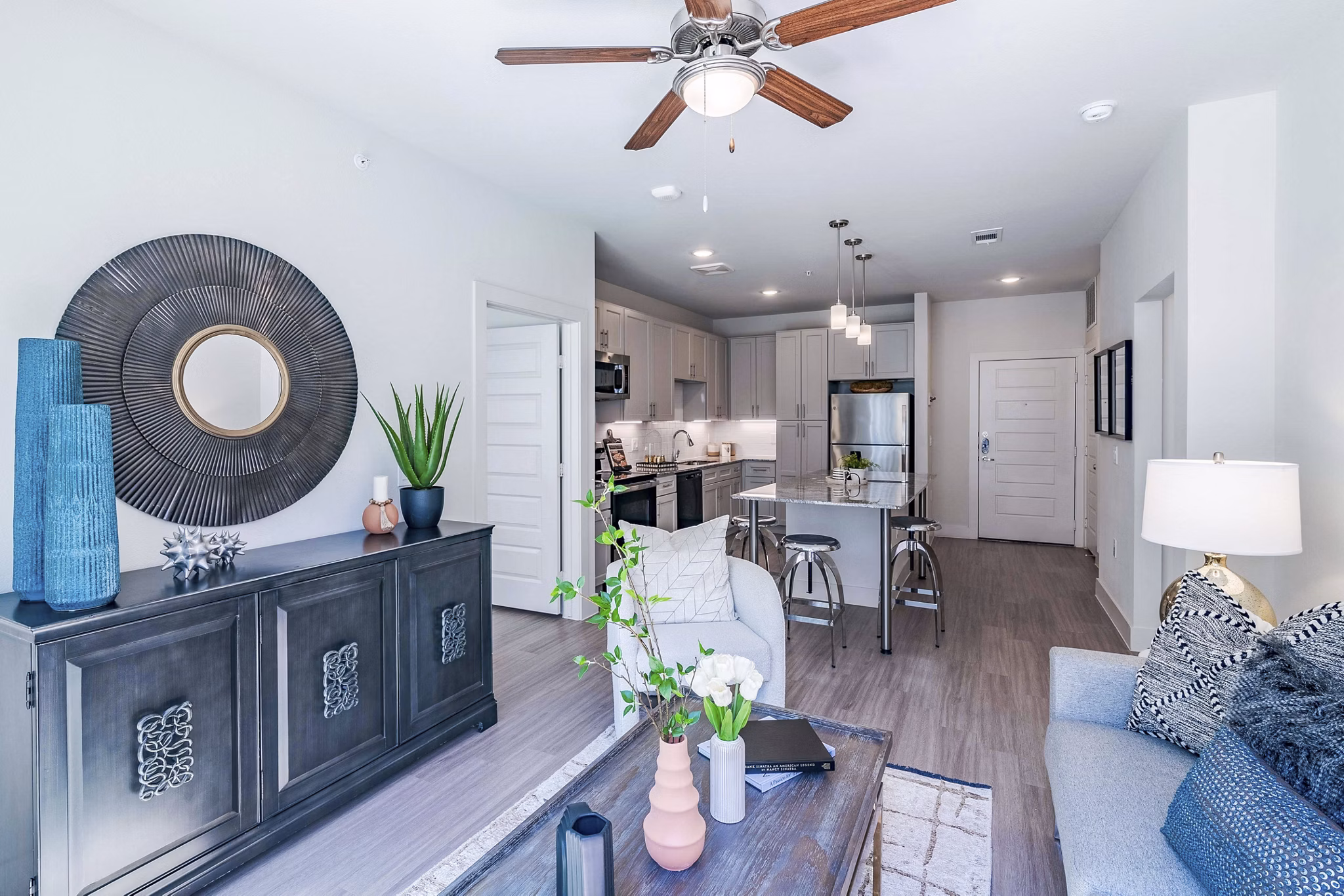 Spacious living room with contemporary decor in The District at Little Elm Apartments