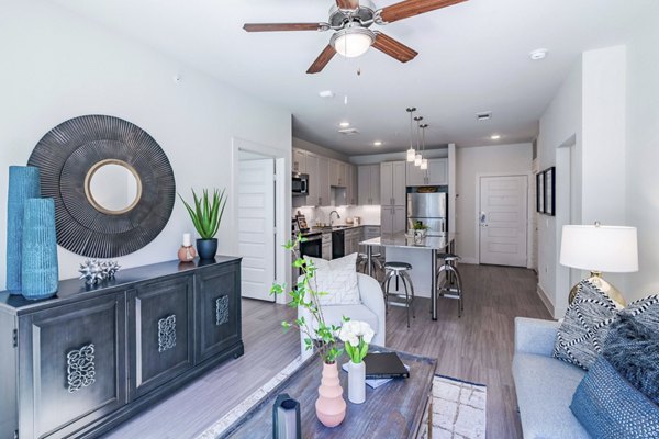 Spacious living room with contemporary decor in The District at Little Elm Apartments