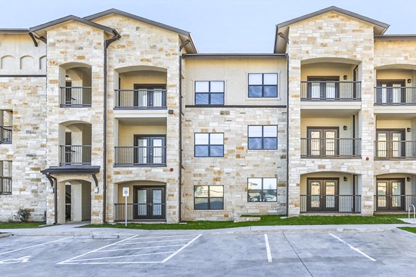 building/exterior at Agora Stone Oak Apartments