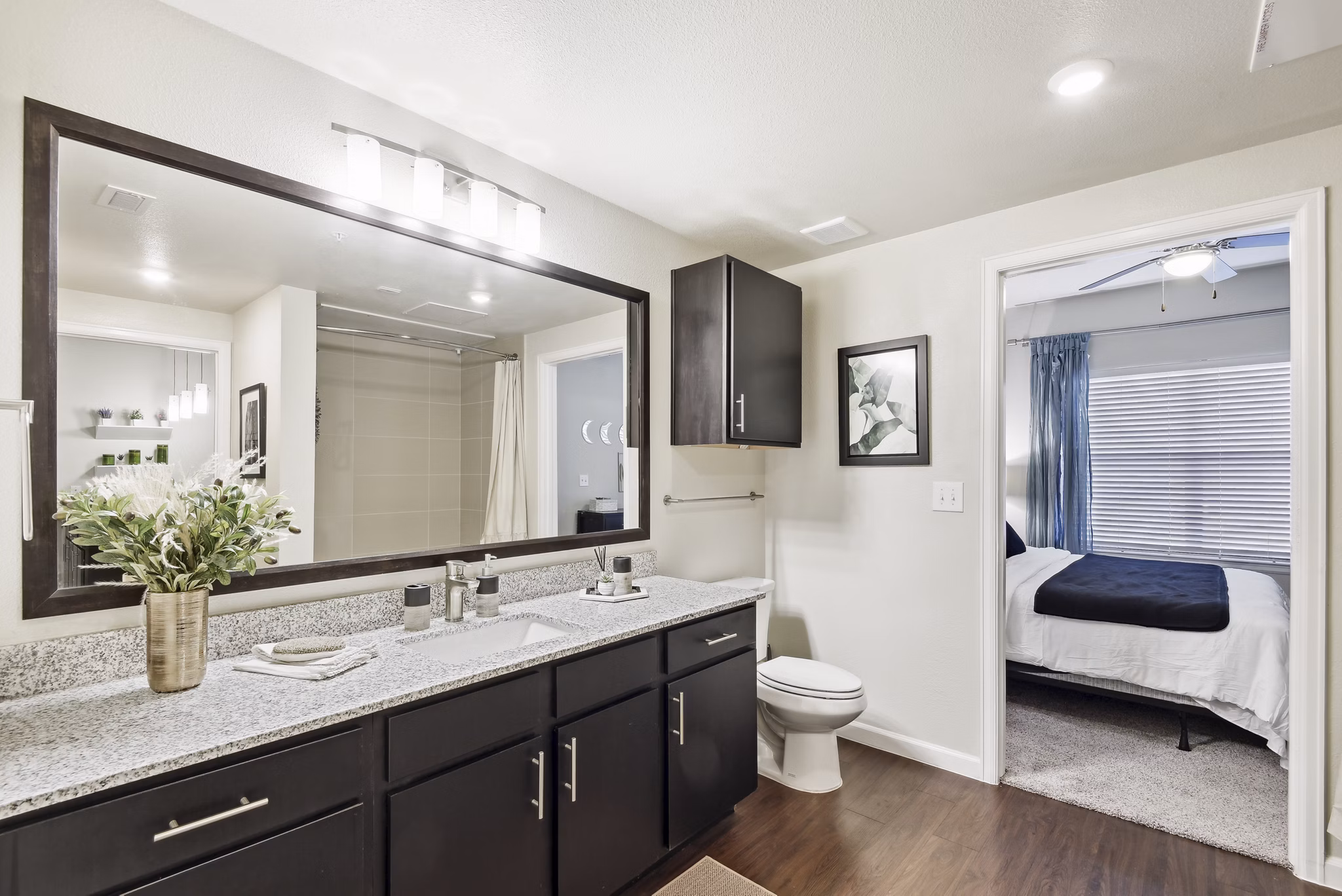 Modern bathroom featuring sleek fixtures and stone countertops at Agora Stone Oak Apartments
