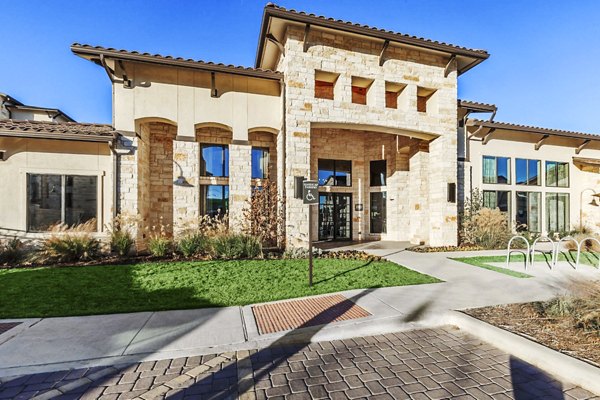 Stylish clubhouse with modern furnishings at Agora Stone Oak Apartments ideal for residents' gatherings and relaxation opportunities