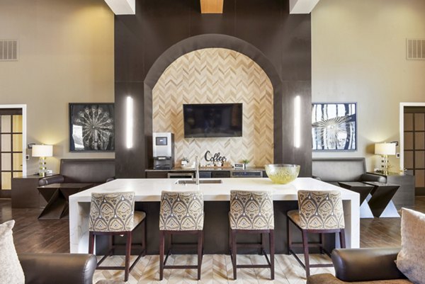 Agora Stone Oak Apartments: Modern clubhouse featuring luxurious seating and large windows in the clubhouse of Agora Stone Oak Apartments