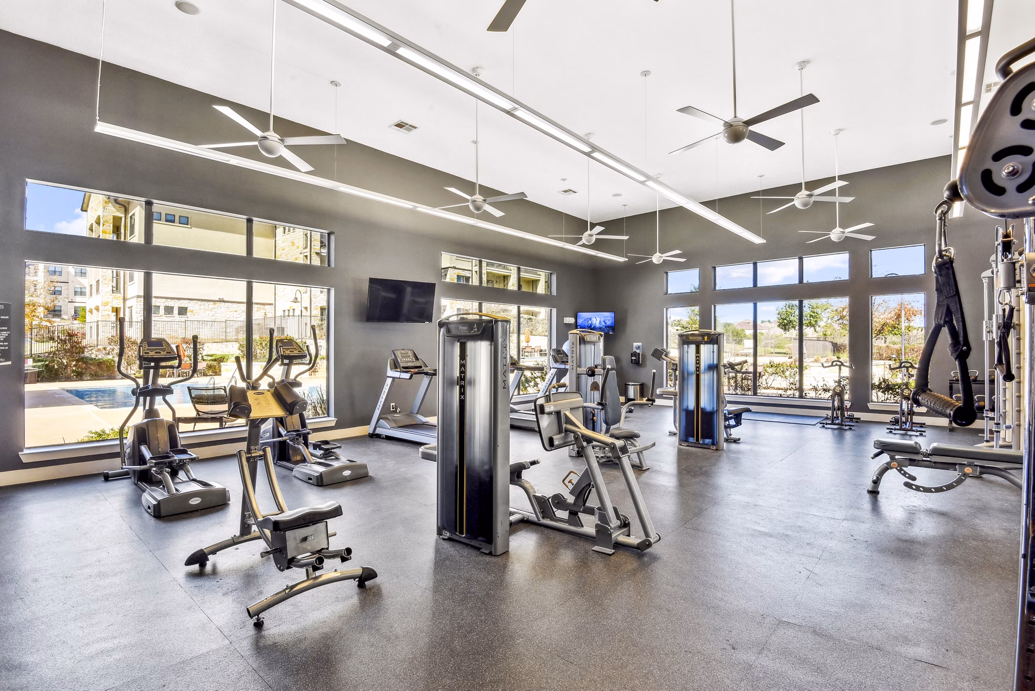 Modern fitness center with state-of-the-art equipment at Agora Stone Oak Apartments