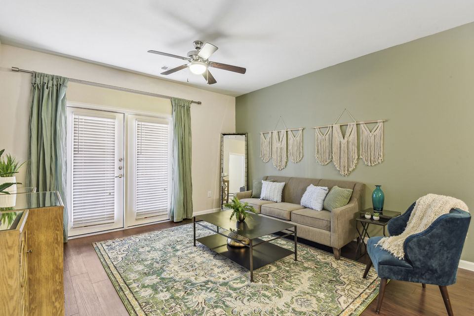 Spacious living room with stylish decor at Agora Stone Oak Apartments