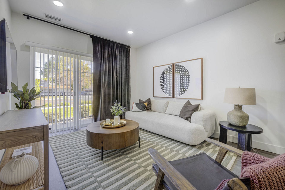 Spacious living room featuring modern decor at The Opal Apartments, a luxury Greystar property