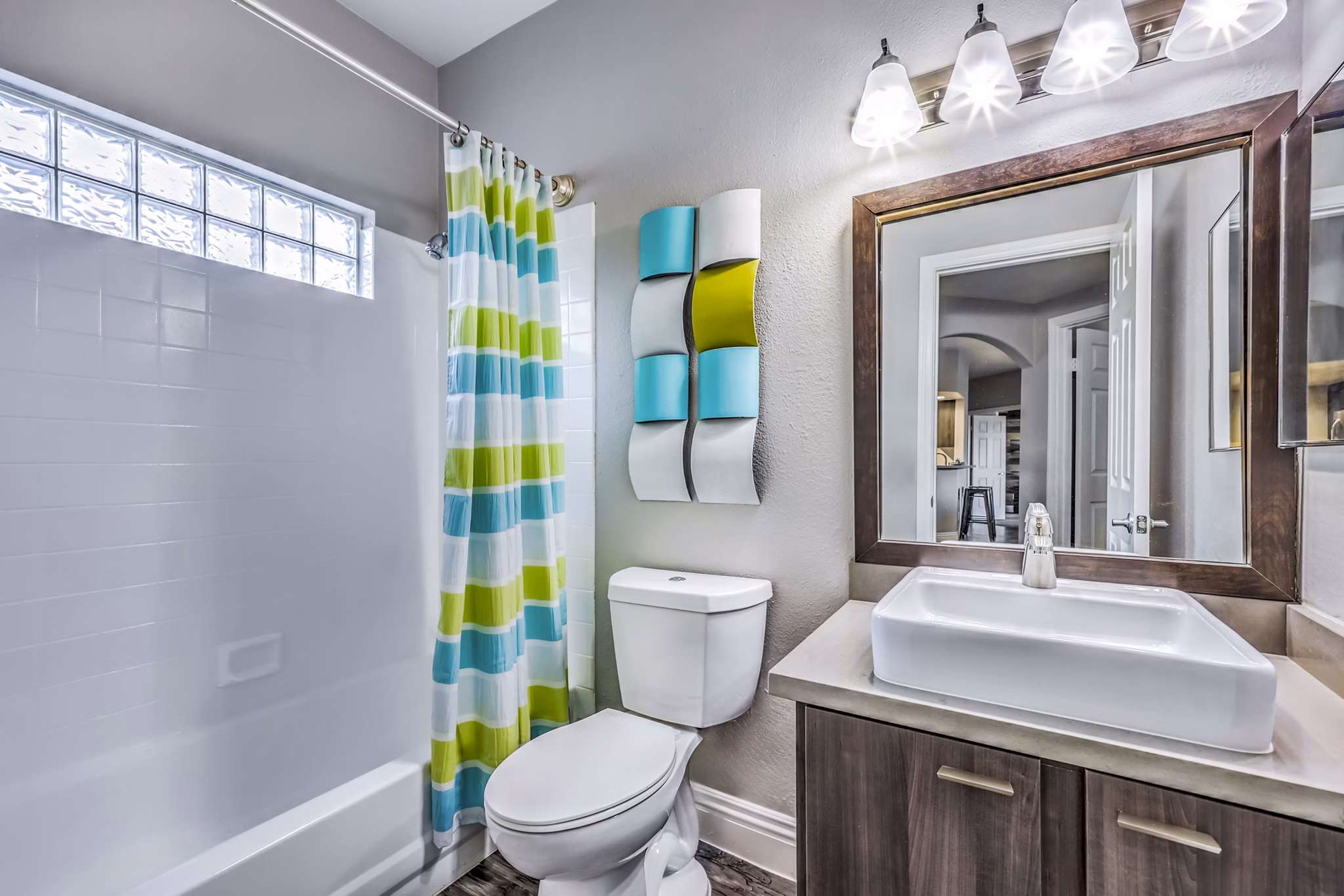 Bathroom featuring sleek fixtures and tiled flooring at Parkway Townhomes