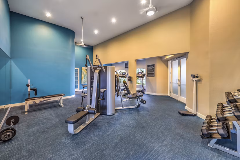 Modern fitness center with state-of-the-art equipment at Parkway Townhomes luxury apartments