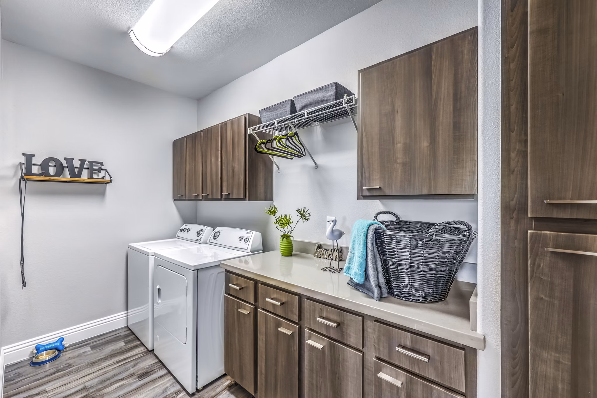 Laundry room featuring modern appliances at Parkway Townhomes Apartments