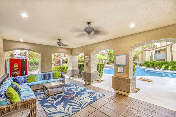Outdoor pool patio with seating at Parkway Townhomes