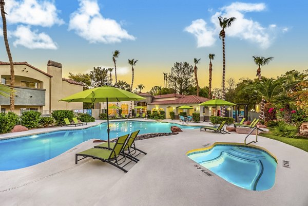 Pool area with lounge chairs at Parkway Townhomes, providing a luxurious setting for relaxation and socializing