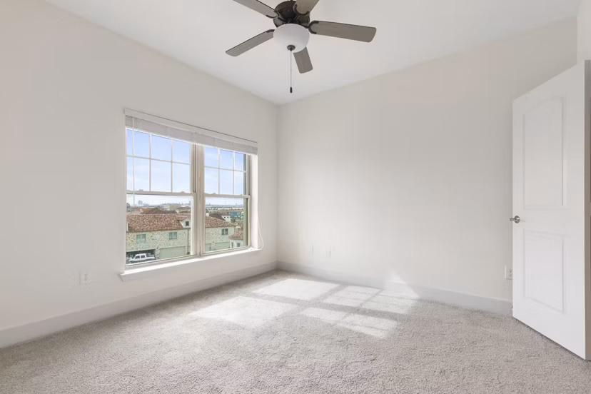 Luxurious bedroom with ocean views at Lighthouse Pointe Apartments