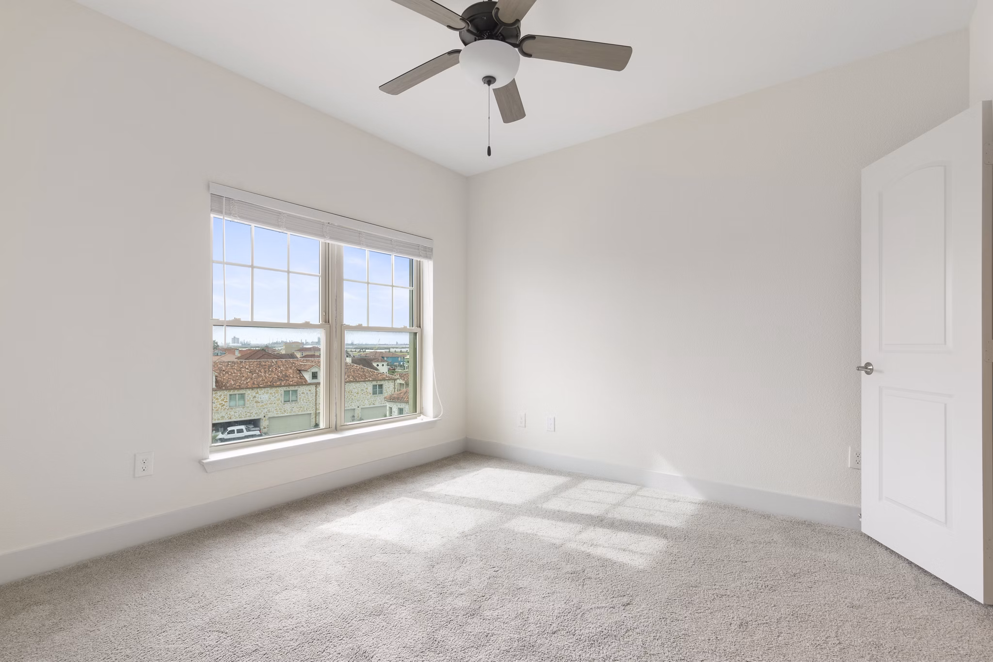 Luxurious bedroom with ocean views at Lighthouse Pointe Apartments