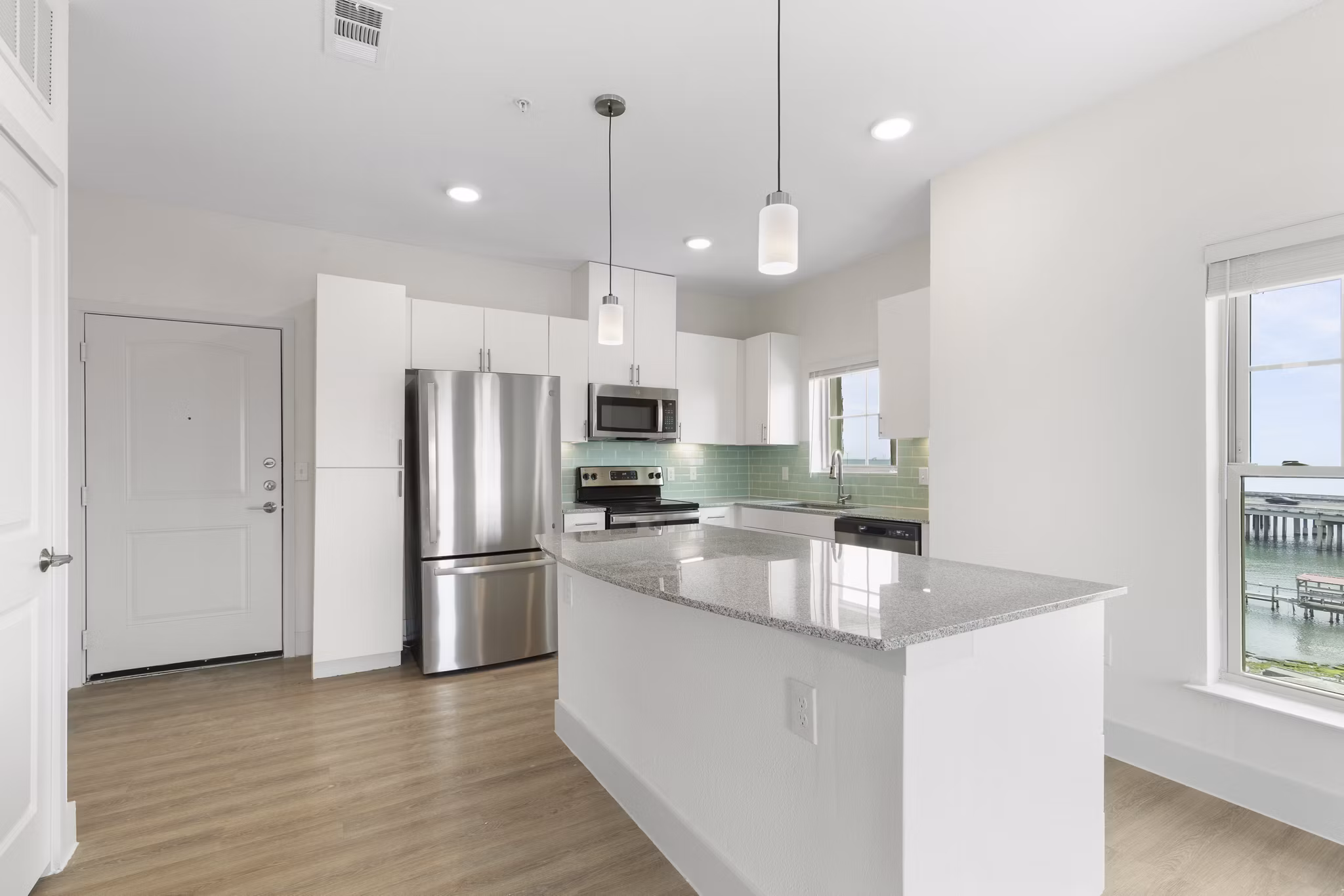 Modern kitchen with stainless steel appliances at Lighthouse Pointe Apartments