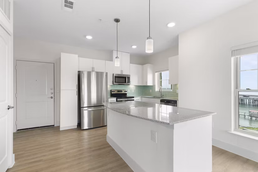 Modern kitchen with stainless steel appliances at Lighthouse Pointe Apartments