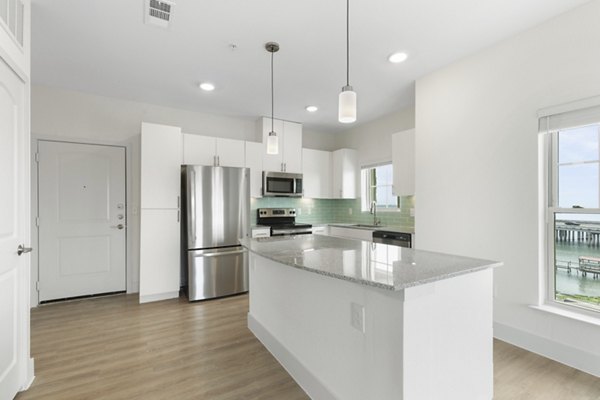 Modern kitchen with stainless steel appliances at Lighthouse Pointe Apartments