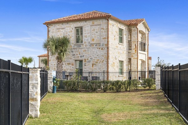 Expansive dog park with lush greenery at Lighthouse Pointe Apartments, a Greystar community