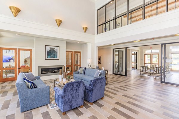 Luminous lobby featuring modern seating and elegant lighting at Wyldewood Gosling Apartments