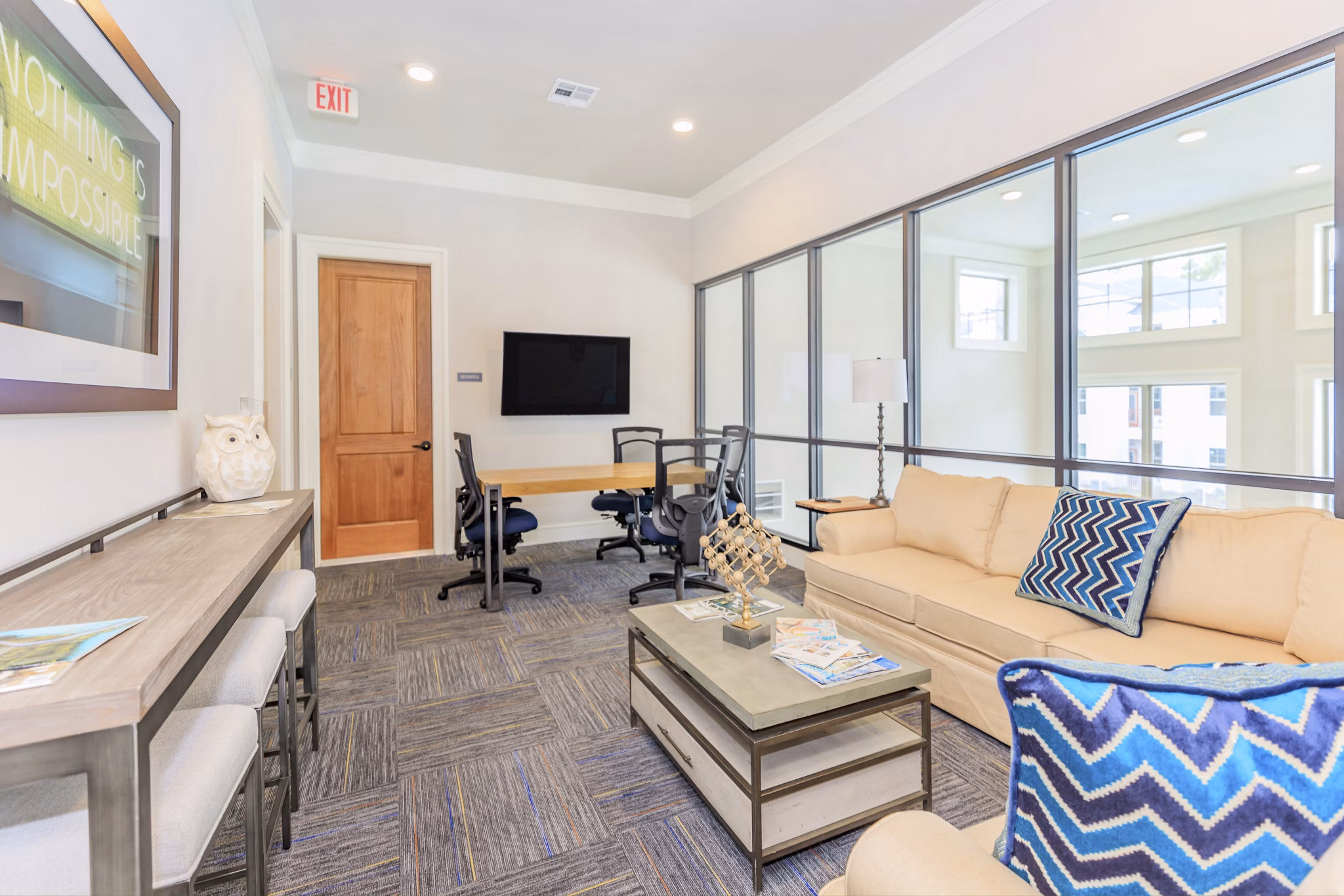 Wyldewood Gosling Apartments: Modern home office with ergonomic desk and natural light for a productive work-from-home experience
