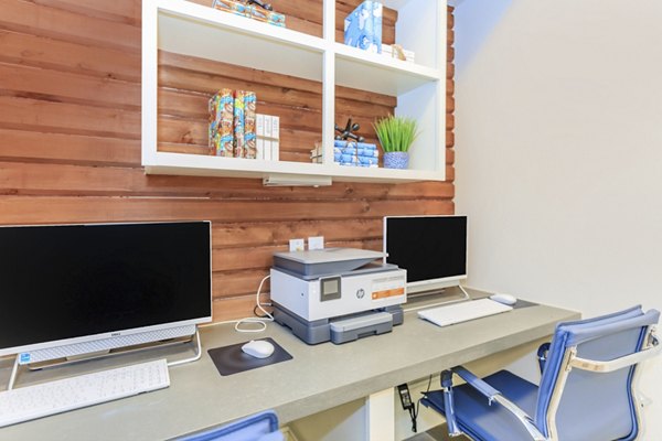 Home office with modern desk and ergonomic chair at Wyldewood Gosling Apartments