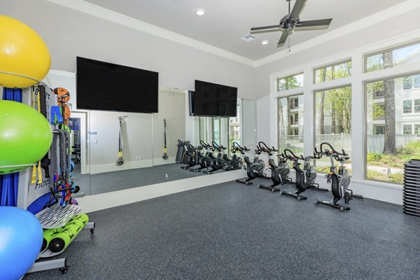 Fitness center with modern equipment at Wyldewood Gosling Apartments offering residents a premier workout experience