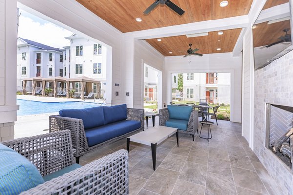 Stylish outdoor patio with modern seating at Wyldewood Gosling Apartments offering a relaxing space for residents to unwind