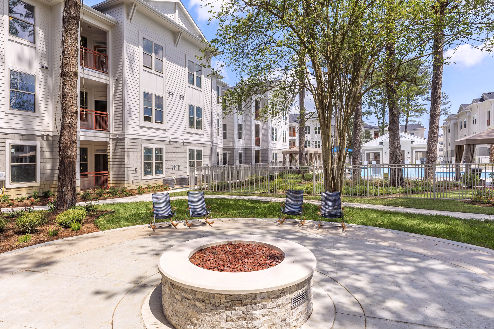 Colorful playground with slides and swings at Wyldewood Gosling Apartments