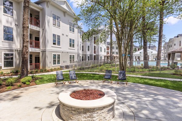 Colorful playground with slides and swings at Wyldewood Gosling Apartments