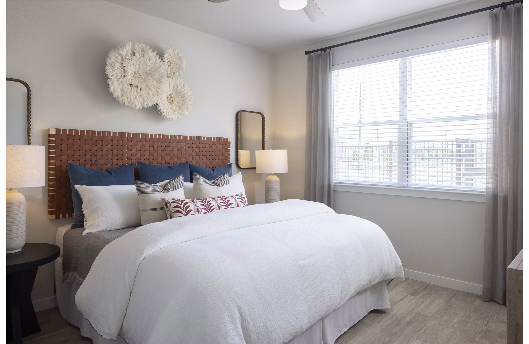 Modern bedroom featuring cozy queen bed and stylish decor at Prose Sterling Apartments