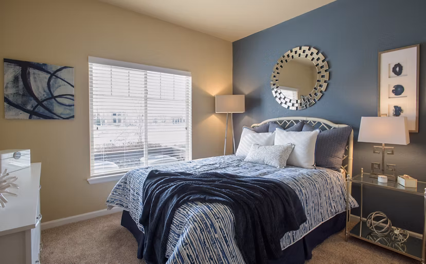 Elegant bedroom with modern furnishings at Whisper Sky Apartments