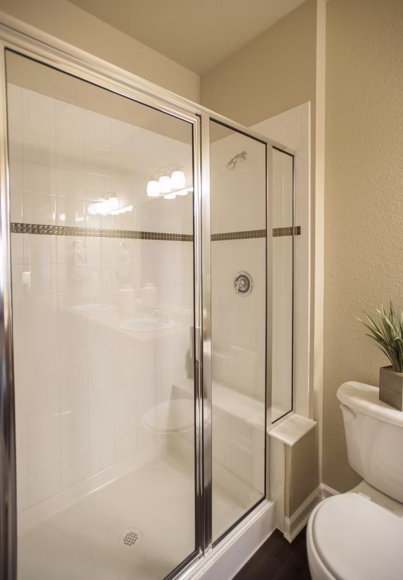 Bathroom with sleek fixtures and marble countertops at Whisper Sky Apartments, offering modern living in a luxury setting