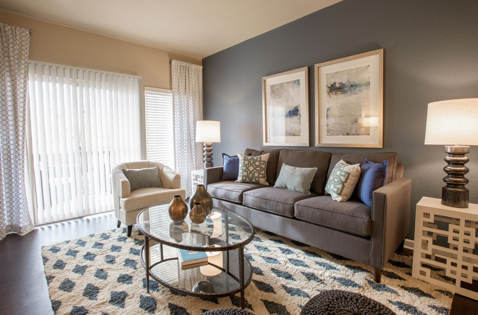Spacious living room with modern decor and natural light at Whisper Sky Apartments, luxury residences by Greystar