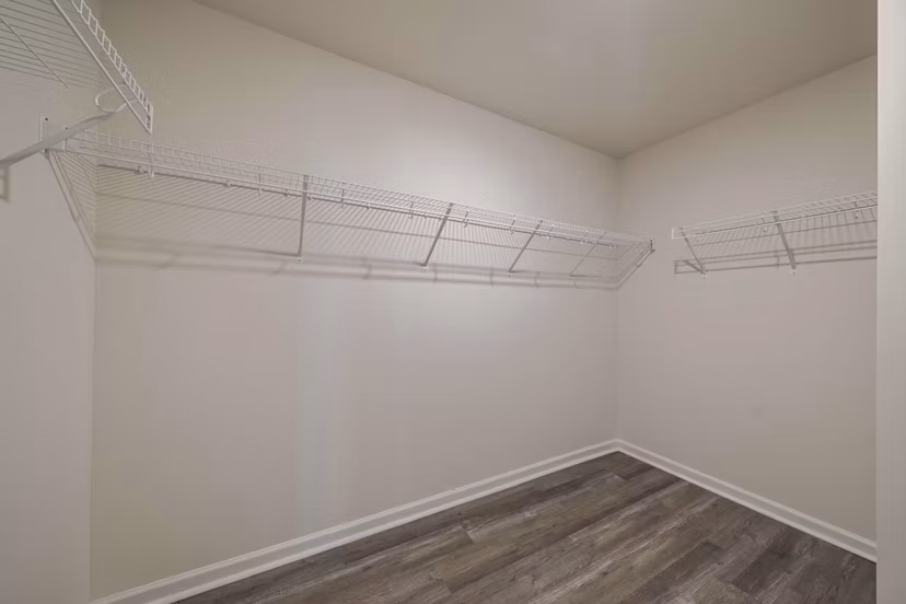 Cozy bedroom with modern decor at Summerwell Harmony Apartments: Luxury living near amenities