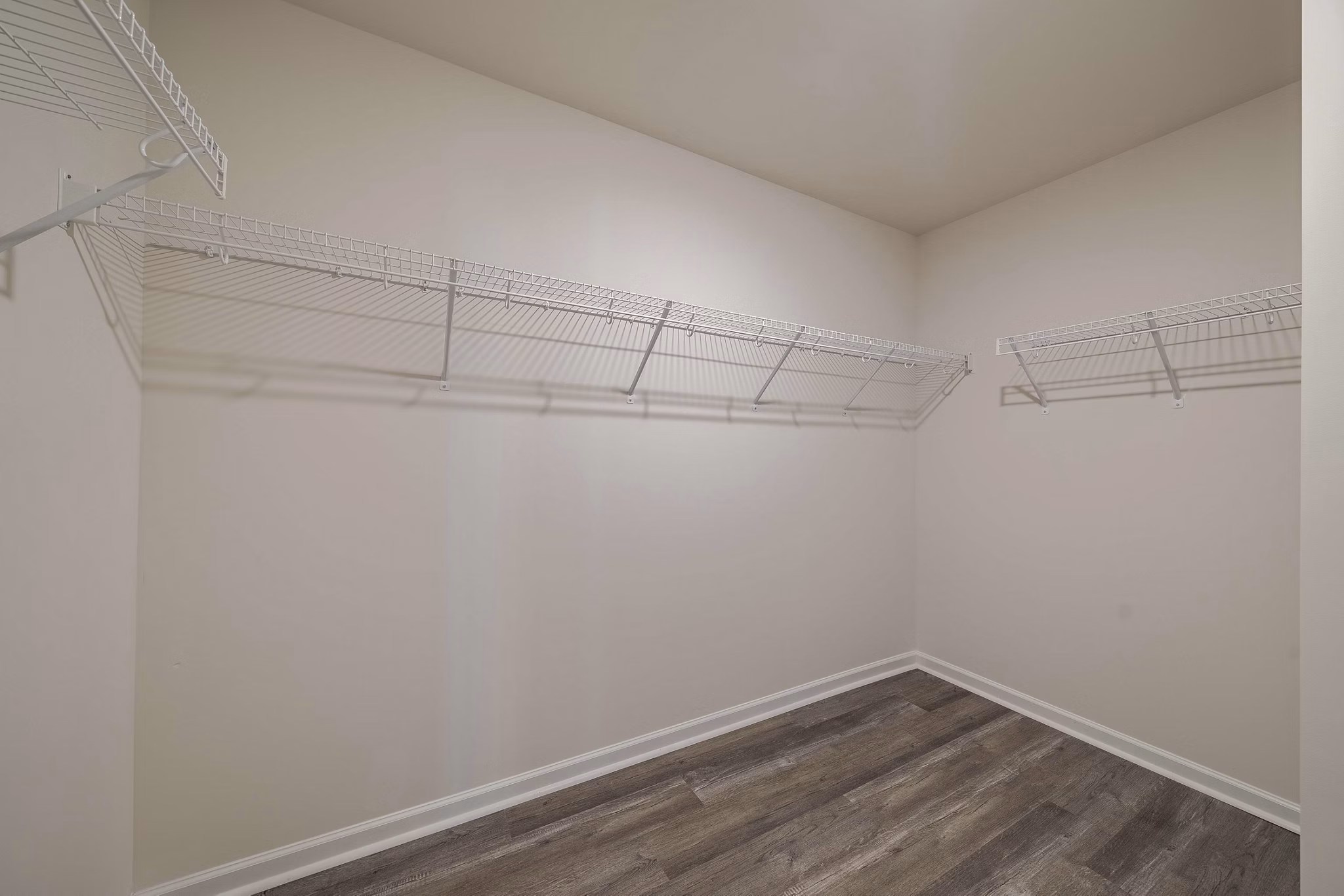 Cozy bedroom with modern decor at Summerwell Harmony Apartments: Luxury living near amenities