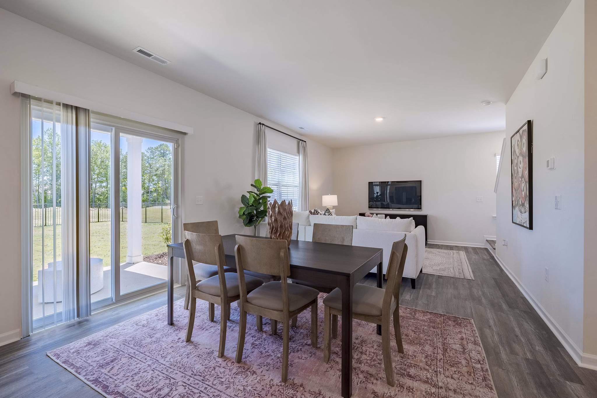 Dining area with modern furnishings in Summerwell Harmony Apartments offering luxury living