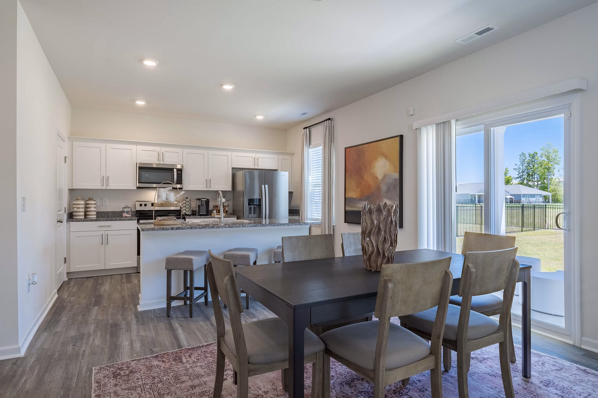 Dining room with elegant dÃ©cor and large windows at Summerwell Harmony Apartments, ideal for luxury living experiences