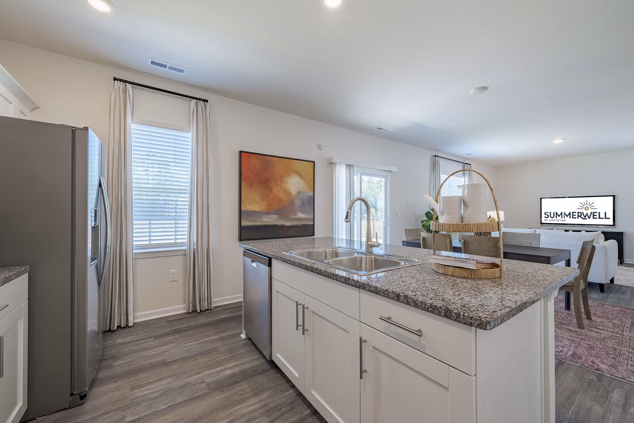 Modern kitchen with stainless steel appliances at Summerwell Harmony Apartments
