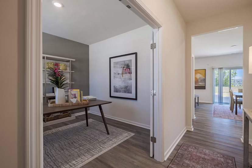 Spacious living room with modern decor and natural light at Summerwell Harmony Apartments