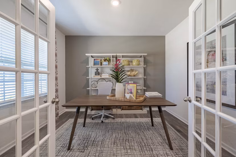 Spacious living room with modern furniture in Summerwell Harmony Apartments