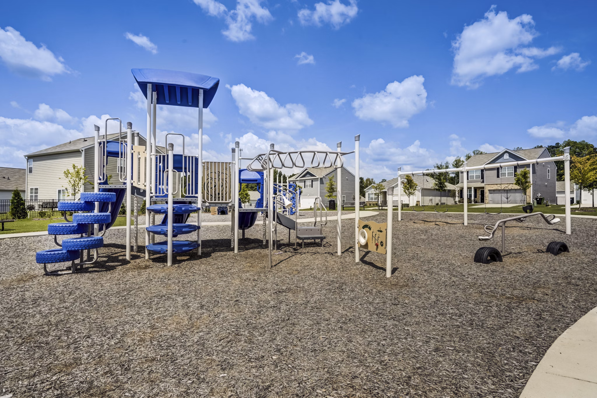 Playground area for children at Summerwell Harmony Apartments offering safe outdoor activities for family-friendly fun
