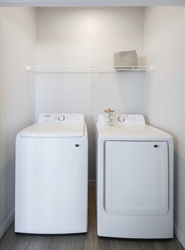 Functional laundry room with modern appliances at Prose Thunder Rock Apartments for convenient living