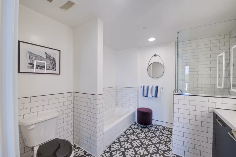 Modern bathroom with marble countertops and sleek fixtures at Fitz on Fairfax Apartments, luxury community in Los Angeles