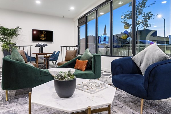 Clubhouse with modern decor at Fitz on Fairfax Apartments, offering luxury amenities in a vibrant community atmosphere