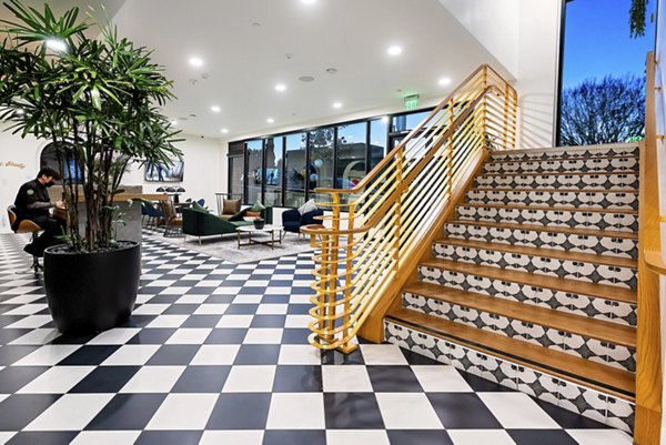 Modern clubhouse with sleek design at Fitz on Fairfax Apartments, offering luxury community space for residents