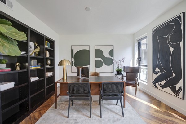 Modern home office with sleek desk and ergonomic chair at Fitz on Fairfax Apartments
