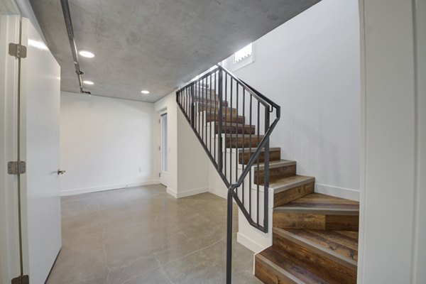 Modern hallway with sleek design and soft lighting at Fitz on Fairfax Apartments