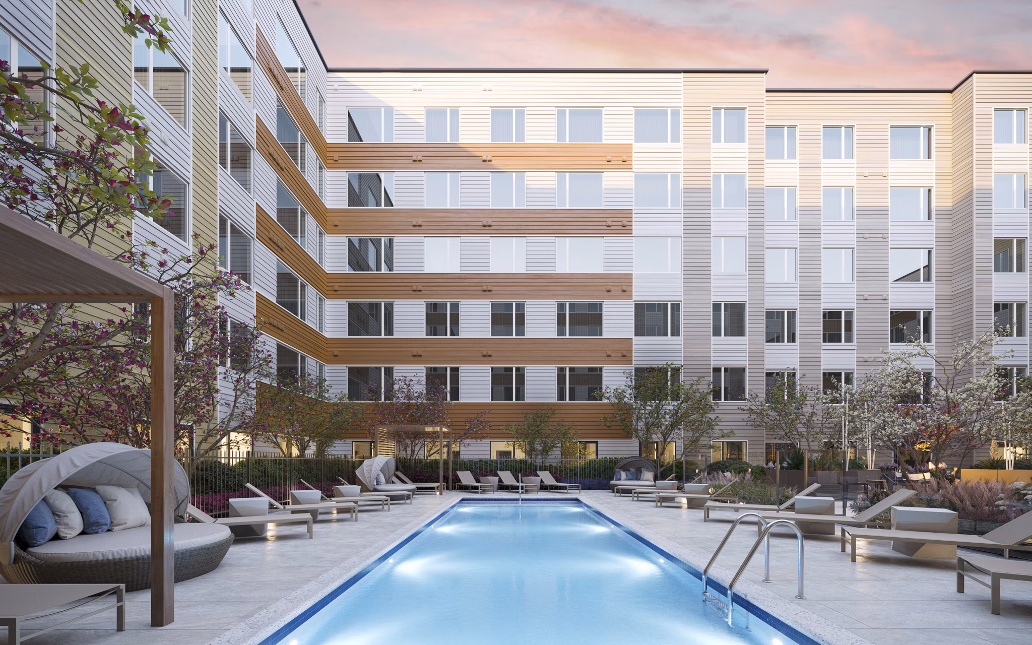 Resort-style pool with lounge chairs at Maxwell Apartments, ideal for relaxation and leisure