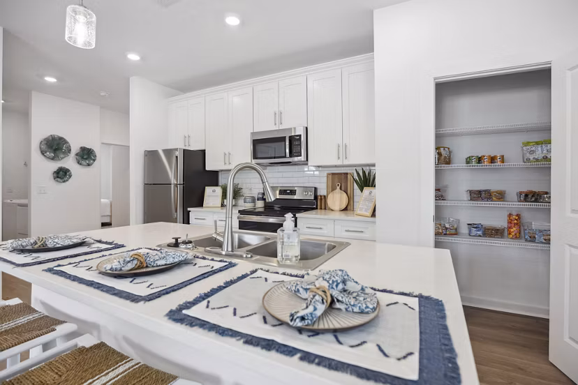 Modern kitchen with stainless steel appliances at River Rock at Dallas Apartments